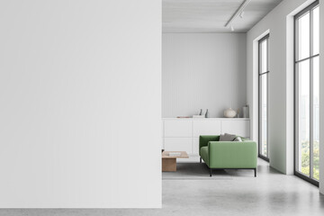 Stylish office relax interior with sofa, drawer and window. Mockup wall