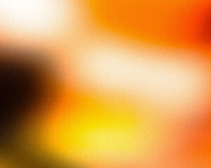close-up of a blurred background in shades of yellow, orange, and brown. The colors evoke a sense...
