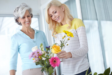 Flowers, mom and happy woman with vase in home together with smile, love and wellness for...