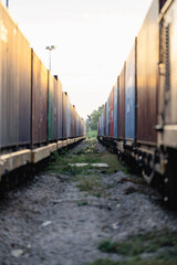 Many containers are on trains that move on rails according to the rail transportation concept and drive the transportation industry.