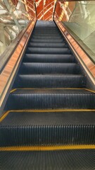 an escalator is shown with a yellow stripe