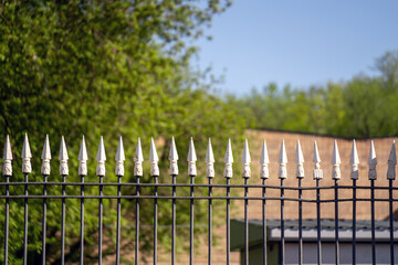 Metal fence with sharp white tips for security