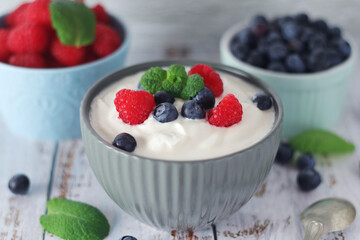 A bowl with Greek yogurt with berries