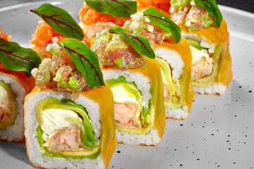 Colorful mamenori sushi rolls with tempura shrimp and salmon