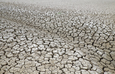 Dried soil surface, waterless sewer pipes after long time hot season at Mekong Delta, Viet Nam,...