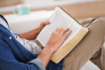 Person, hands and reading bible or scripture for Christianity religion for information, Jesus or...
