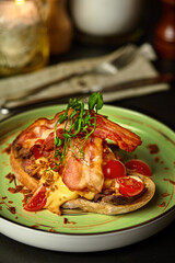 Bruschetta with veal steak, sauce, crispy onions and fried bacon