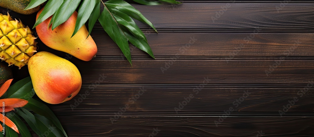 Poster tropical fruits like mango and papaya displayed on a wooden background in a top view setting with co