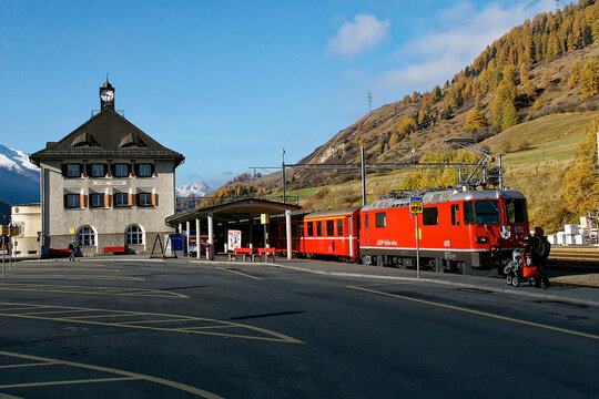 RHB railway station Scuol-Tarasp in the Swiss Alps on a sunny autumn day with red train. Photo taken November 1st, 2007, Scuol, Switzerland.