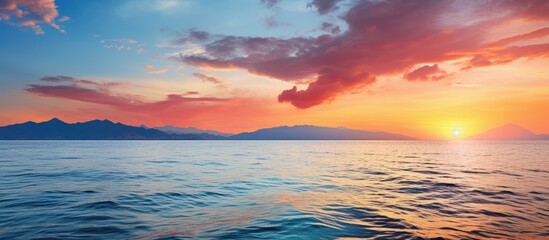Scenic seascape with a colorful sunset over the water ideal for a copy space image