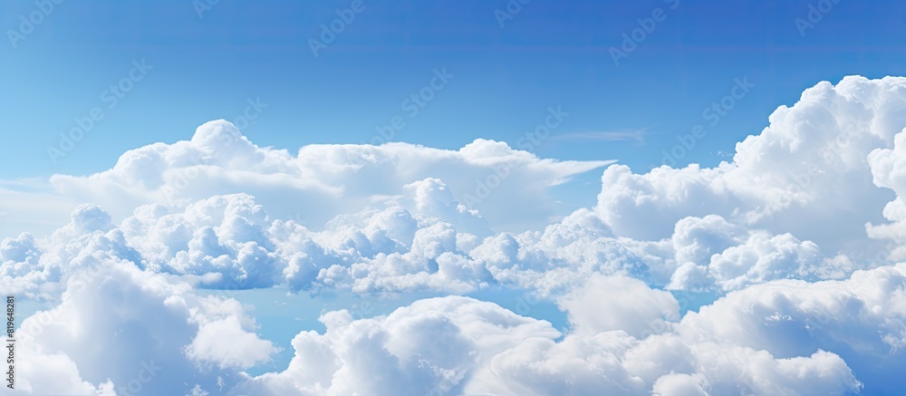 Poster background with a pattern of white clouds against a sky creating a picturesque copy space image