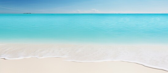 Beach with white sands and clear turquoise water perfect for a copy space image