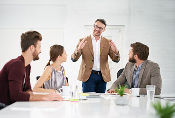 Business team, conversation and meeting in office for strategy for project management, information and client feedback. Discussion, boardroom and creative ideas for collaboration on company task. © peopleimages.com