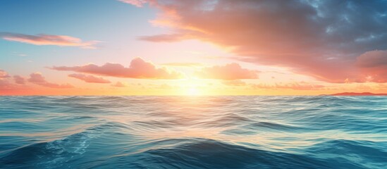 Naklejka premium Scenic sunrise over the tranquil ocean with sun reflection capturing a serene moment in a copy space image