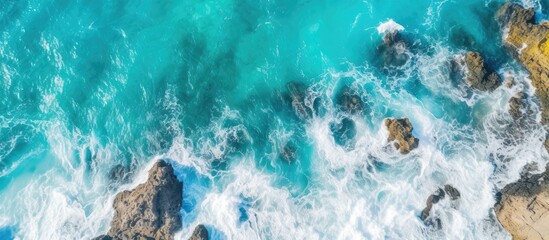 Bird s eye view of a tropical seascape with rocky terrain and vibrant turquoise waters ideal for a copy space image
