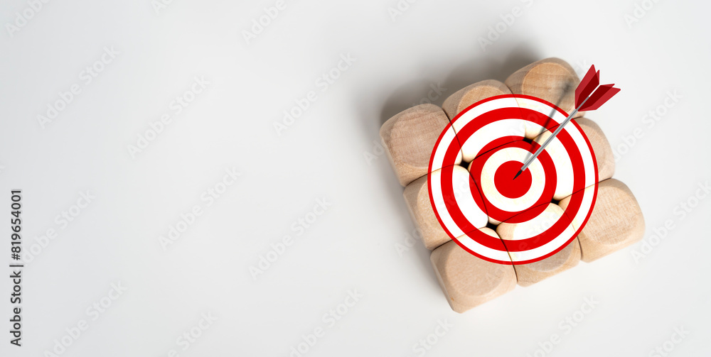 Poster big target icon of symbol on wooden cube blocks stack isolated on white background with copy space.