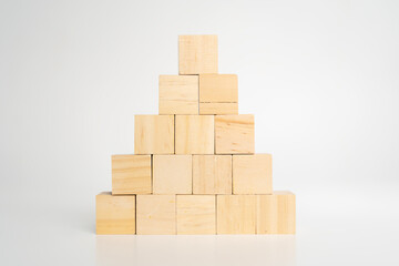 Empty blank wooden cube blocks build pyramid shape with the big one on top.