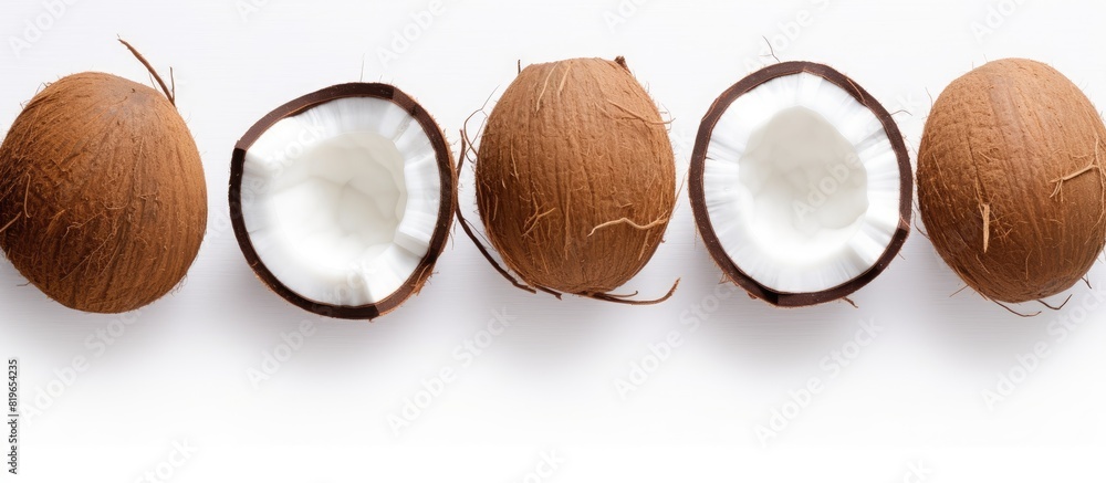 Poster top view of coconut pattern on a white background with copy space image