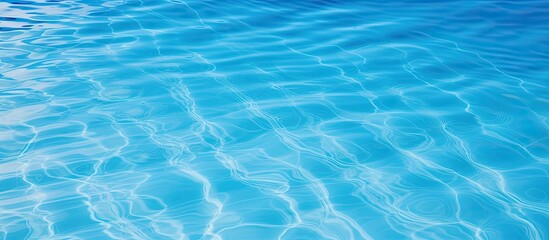 Obraz premium Blue swimming pool surface with water background including copy space image