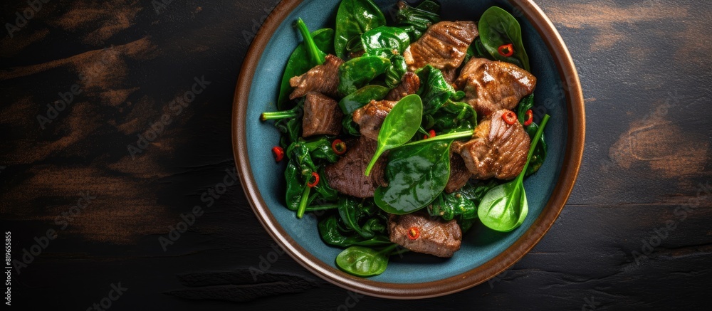Aufkleber top view of a salad combining chicken liver with spinach and chard leaves includes copy space image