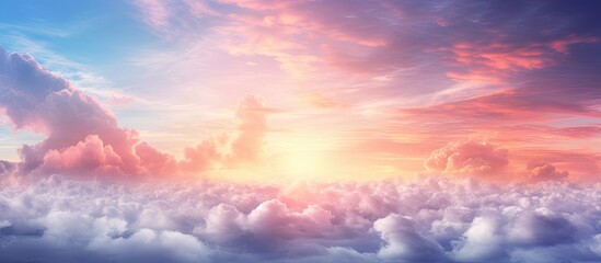 Stunning gradient sky with a mix of warm and cool tones during sunrise and sunset featuring clouds and sun beams against a backdrop perfect for a copy space image