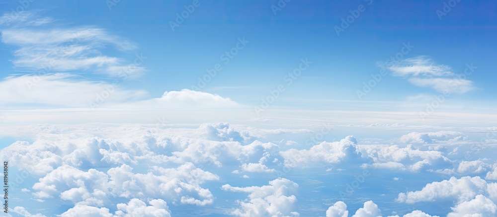 Aufkleber white cloud floating in the vast expanse of the clear blue sky creating a serene and peaceful atmosp