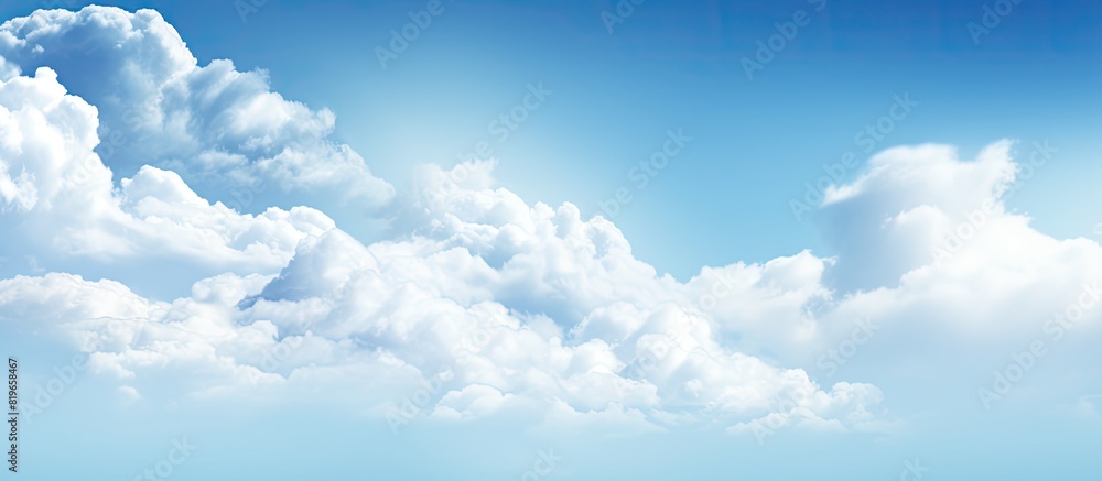 Poster abstract soft blue sky with white clouds creating a blurry backdrop with ample copy space image for 