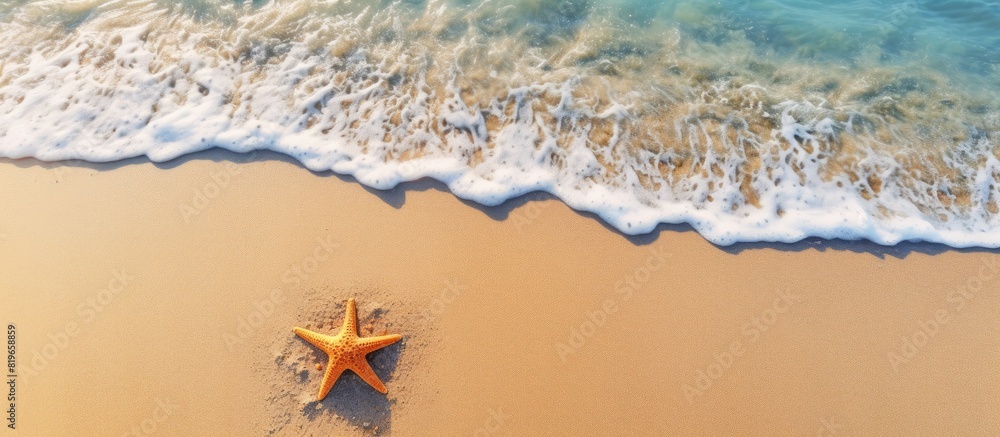Aufkleber a top down view of a starfish resting on the sandy shore of a beach during the summer with ample cop