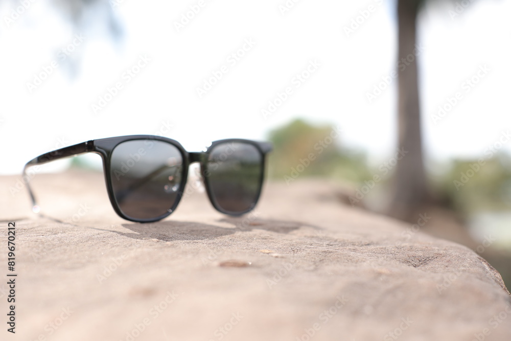 Wall mural sunglasses on the beach