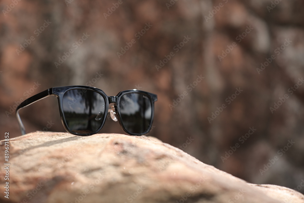 Wall mural sunglasses on the sand