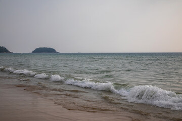 Beautiful beach with colorful water. Top view of the beautiful coastline. Sunny summer day. Colorful water. Sandy beach.	
