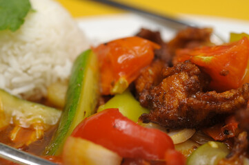 Fried rice with meat and vegetables on a plate, Thai cuisine