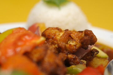 Fried rice with meat and vegetables on a plate, Thai cuisine