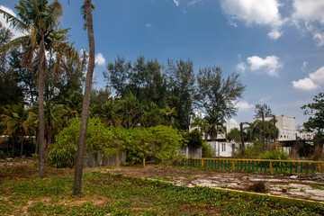Beautiful abandoned hotel on the beach. Swimming pool in an abandoned hotel. Water in the pool. Sunny day.