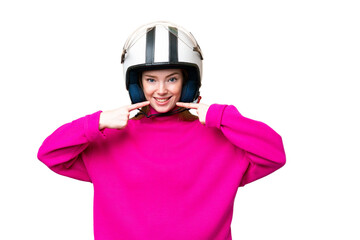 Young pretty woman with a motorcycle helmet over isolated chroma key background giving a thumbs up gesture