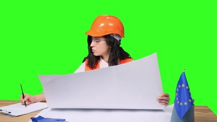 Woman holding blueprints and checking construction on the chroma key