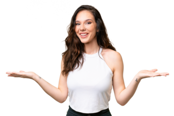 Young caucasian woman isolated over isolated background with shocked facial expression