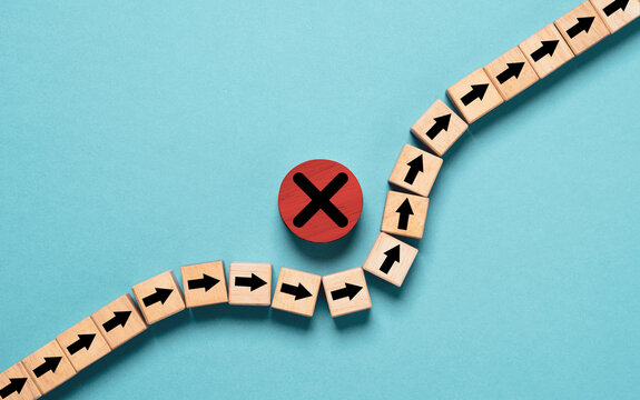 Arrow avoid cross mark which it print screen on wooden block for Avoid problem and find optimize solution to solving concept.