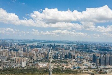Obraz premium Aerial view of a cityscape featuring a winding river and a body of water. Wuhan, China.