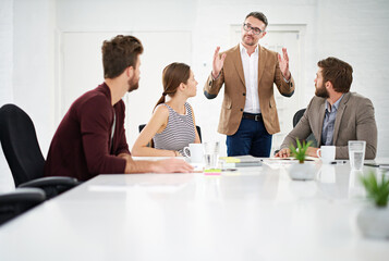Business team, conversation and meeting in office for strategy for project management, information and client feedback. Discussion, boardroom and creative ideas for collaboration on company task. © peopleimages.com