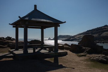 Gazebo overlooking serene body of water in Houyan Island, Fuzhou, China.