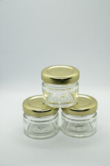 Three stacked jars on a white background
