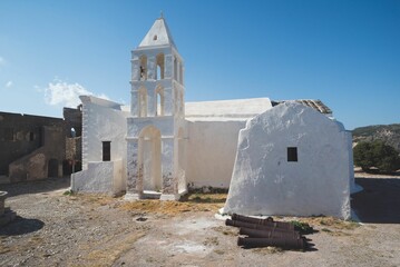 White chapel in an abandoned place on a sunny day
