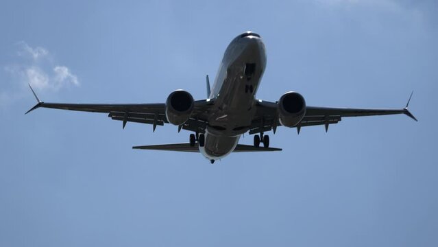 Uzbekistan, Tashkent - may 18, 2024. Boeing 737- max 8 Fly Dubai. Cinematic footage of the approach , the plane comes in for landing against the background of a blue cloudy sky.