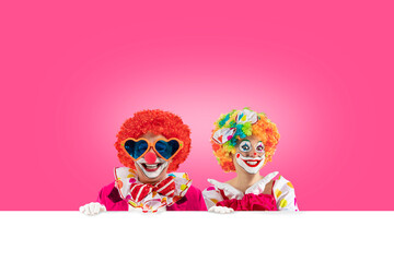 Funny clowns peeking out from behind sign blank template mock up for advertising, posters,...