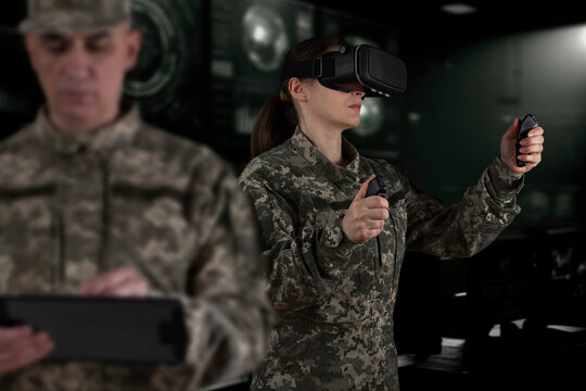 Warfare pilot using head-mounted displays VR glasses, digital device operating with robot, drone or troops of mechanical soldiers. The military's training virtual simulators, AI technology