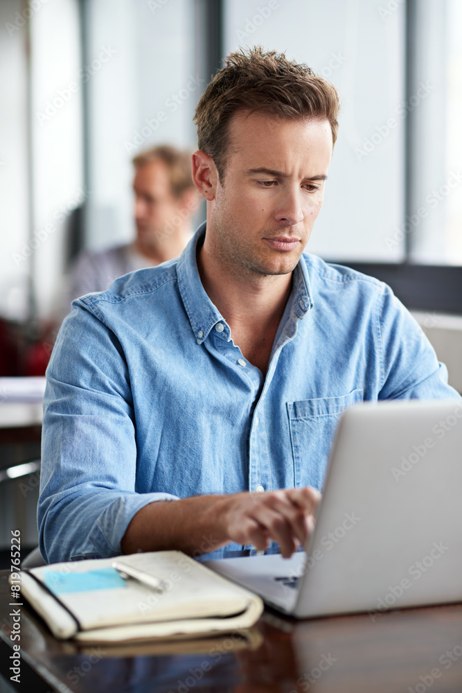 Poster Man, notebook and typing on laptop in modern office for information with planning design, email and internet research. Male programmer, coding language and study on computer for software development