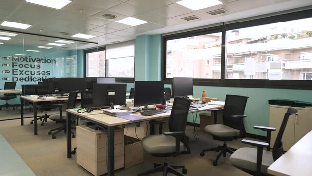 Interior of bright creative workspace with computer desks