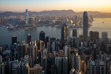 Aerial view of cityscape Hong Kong surrounded by buildings during sunset