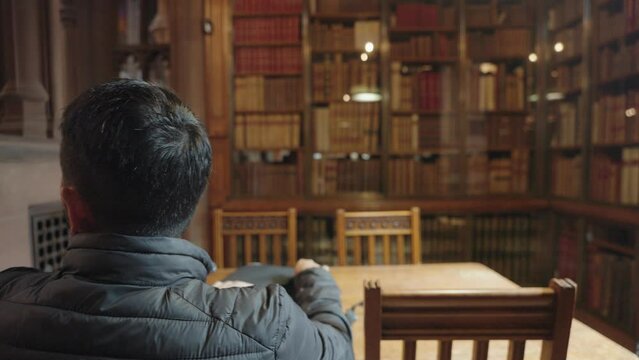 Manchester, UK - The bookshelves in the reading room of the John Rylands Research Institute and Library in Manchester, UK.